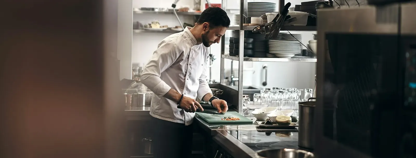 Professional kitchen with stainless counters and equipment