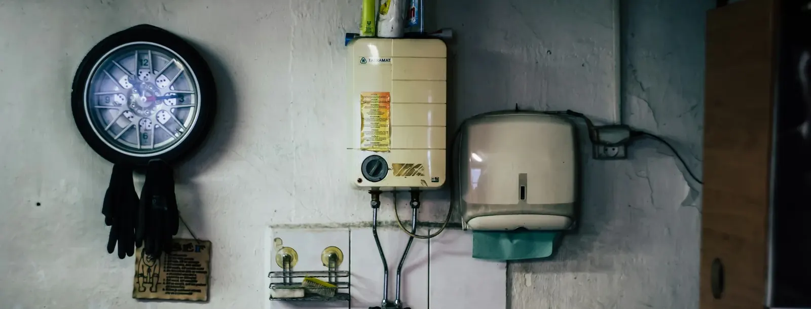 Wall-mounted water heaters and fittings in a utility room